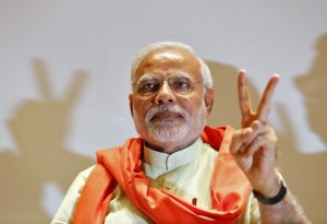 Modi, prime ministerial candidate for the BJP, gestures upon his arrival to meet party leaders and workers at Gandhinagar